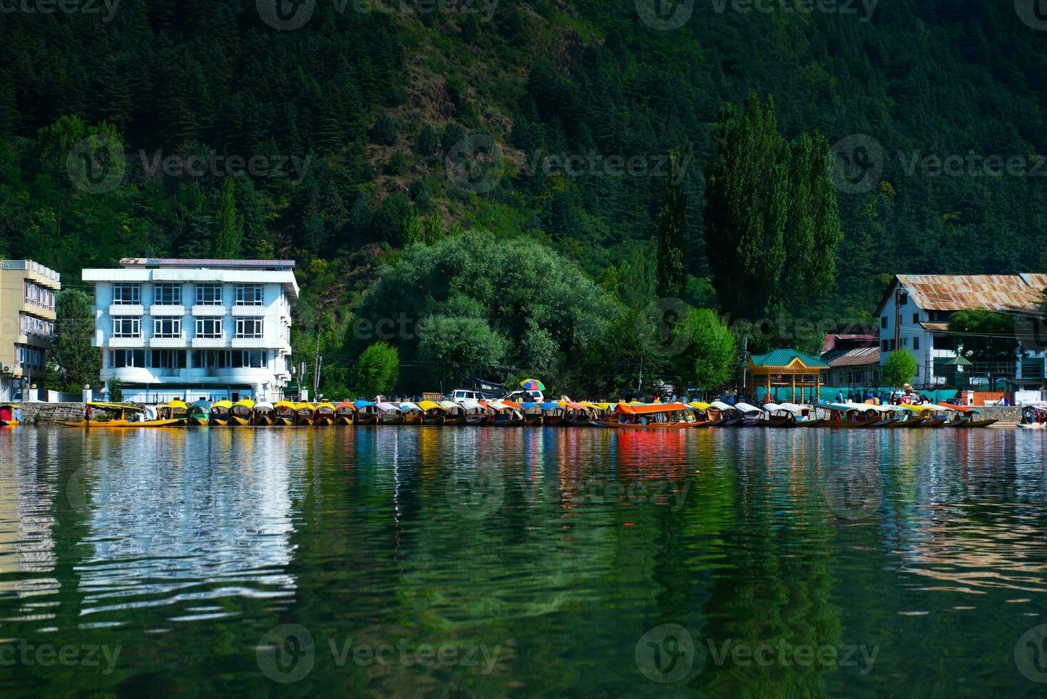 Dal Lake , and the beautiful mountain range in the background in the city of Srinagar, Kashmir, India. photo