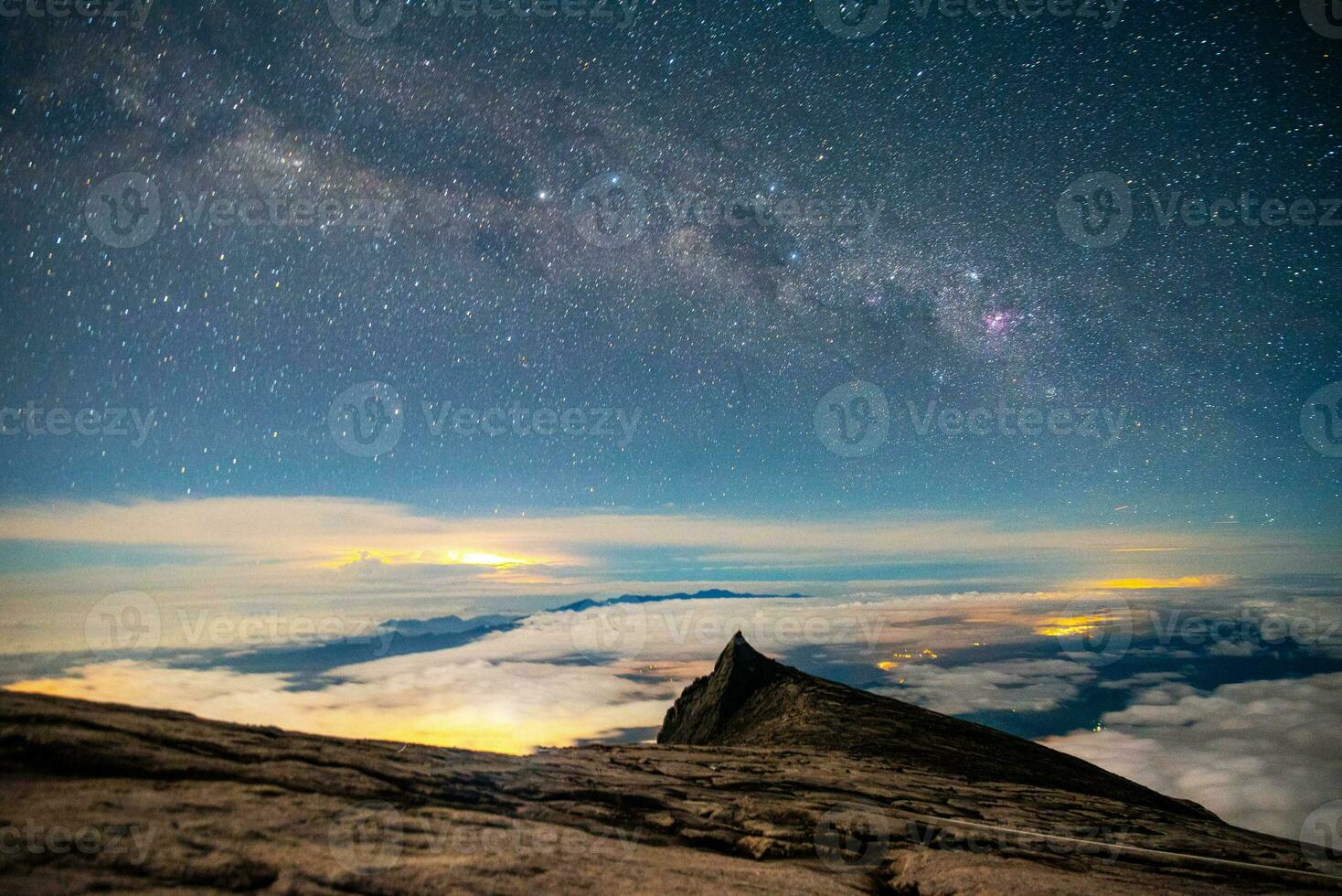 Mount Kinabalu  with milky way galaxy with stars on a night sky background.on Mount Lowes Height approximately 3,900 meters in Malaysia photo