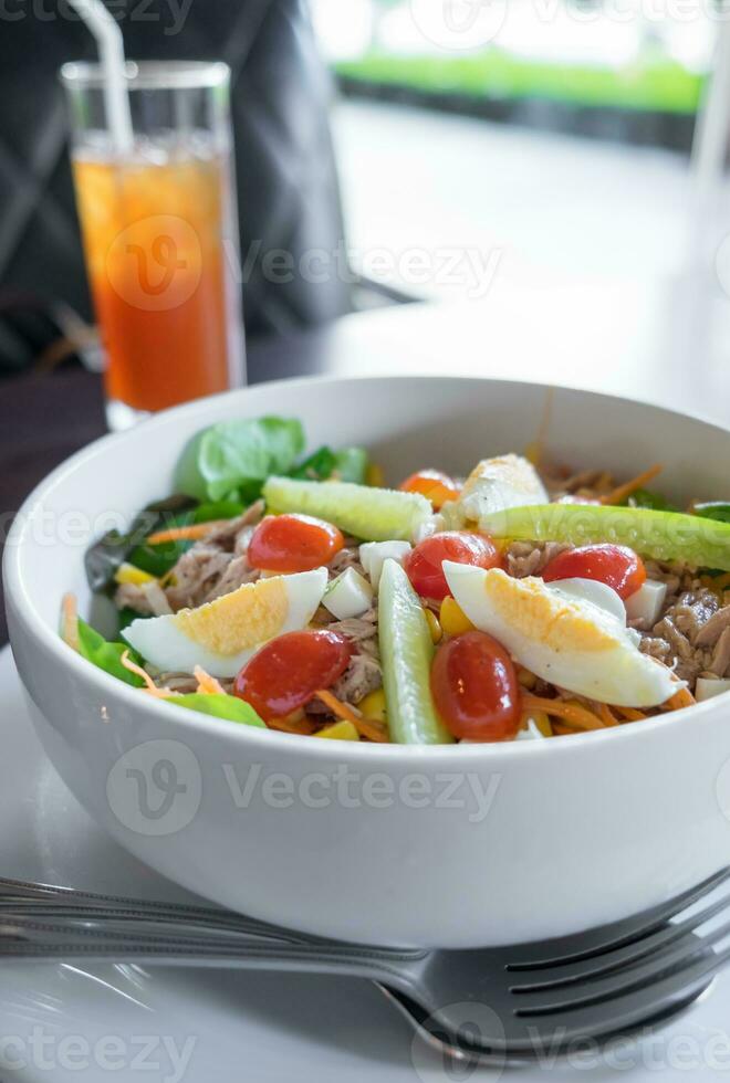 Tuna with vegetable salad in bowl photo