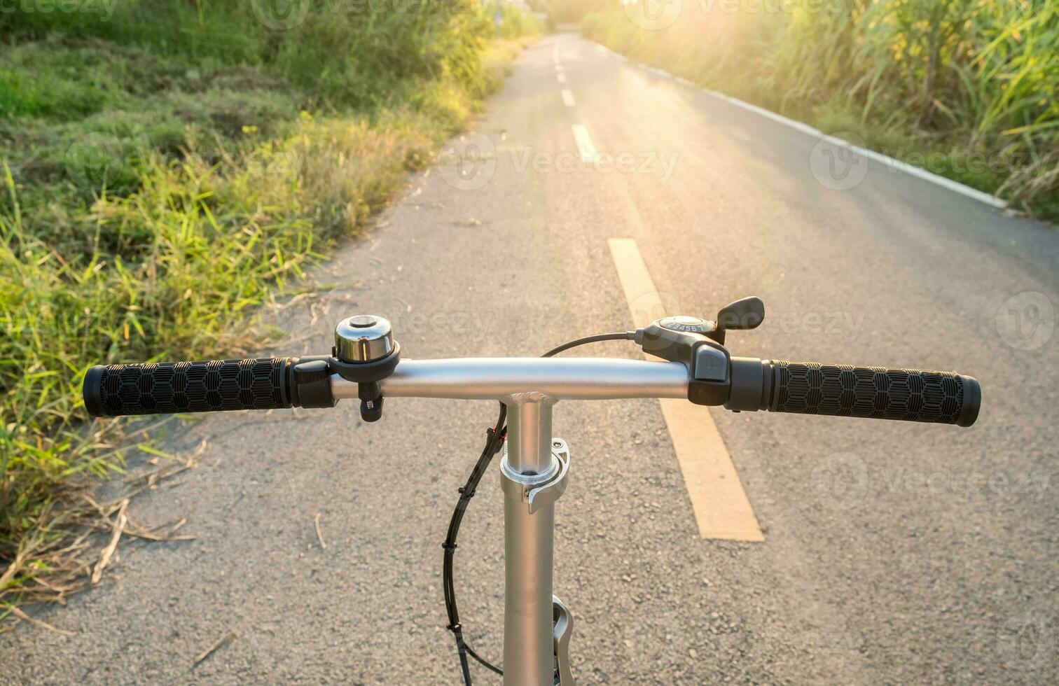 Front handle bar stem biking on rural road photo