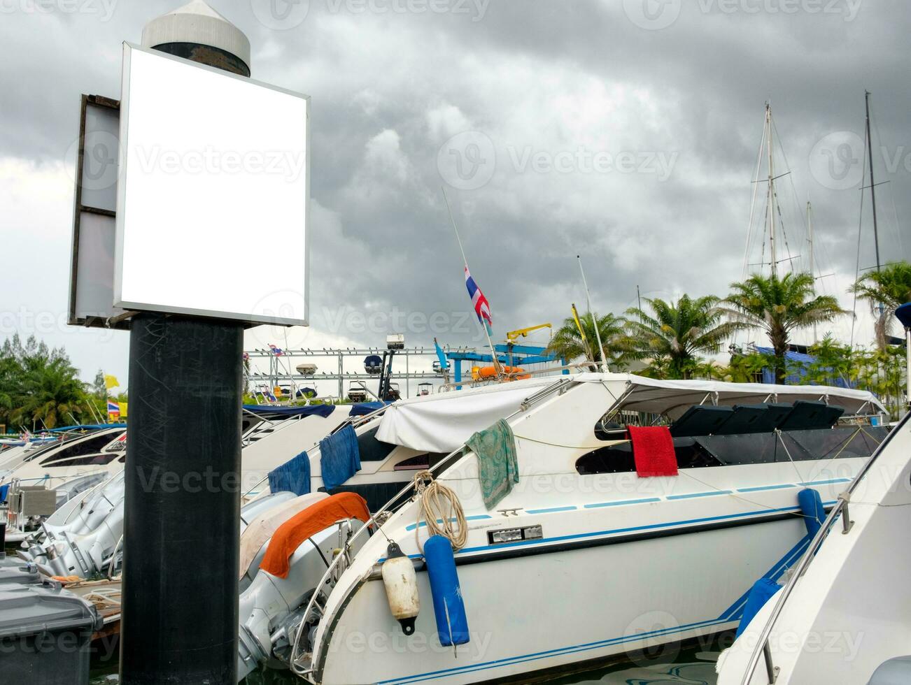 Billboard banner with speedboat on marina photo