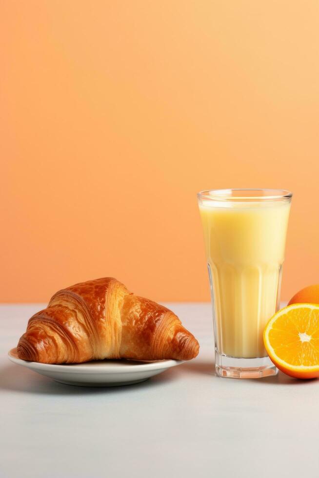 AI generated A glass of orange juice accompanied by a croissant with butter and jam photo