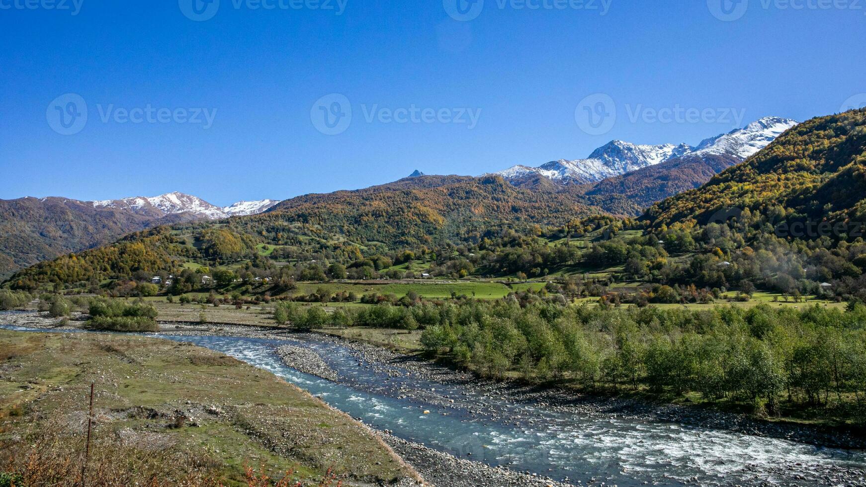 AI generated Tranquil Mountain River Amidst Pristine Peaks photo