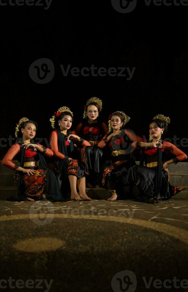 a group of dancers were seen relaxing with their friends and creating a warm atmosphere photo