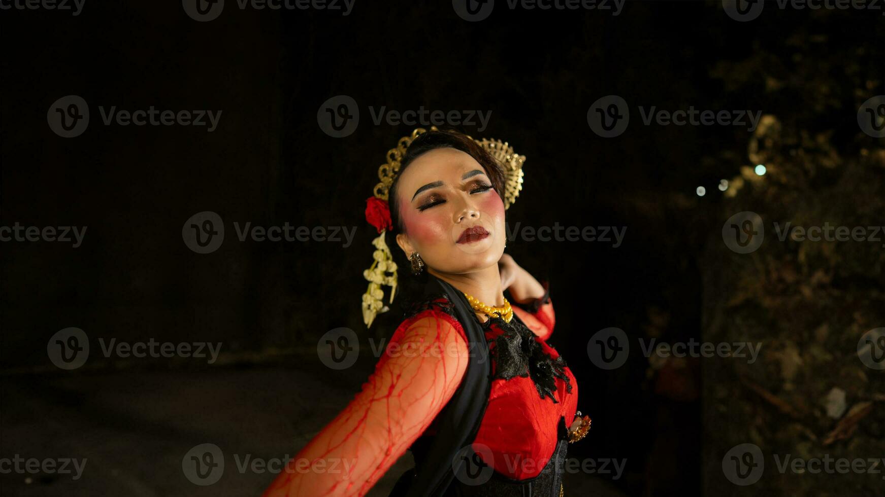 an Indonesian dancer shows a dance that shows the beauty of a tradition full of stories in every movement photo