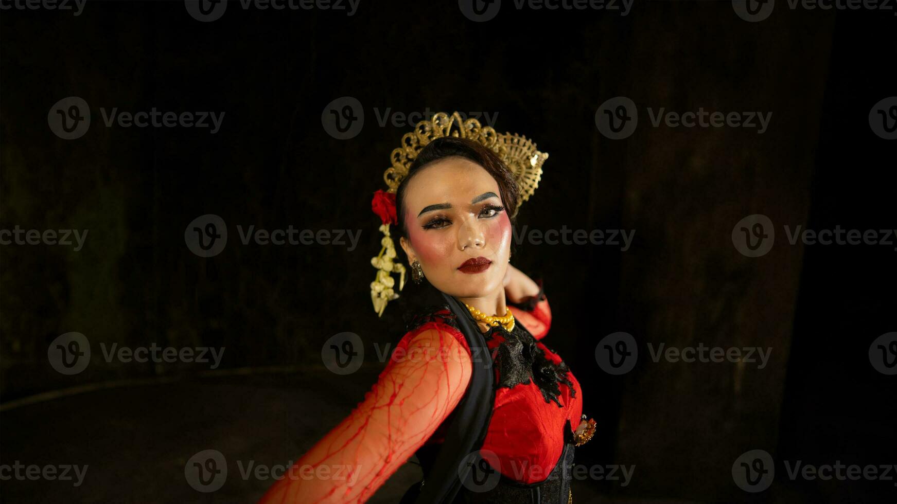 an Indonesian dancer shows a dance that shows the beauty of a tradition full of stories in every movement photo