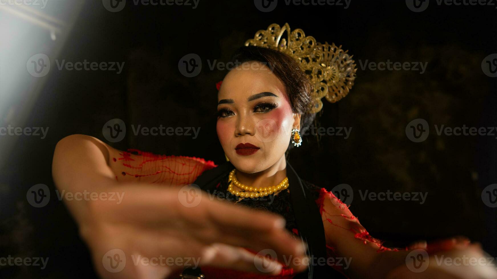 an Indonesian dancer shows a dance that shows the beauty of a tradition full of stories in every movement photo
