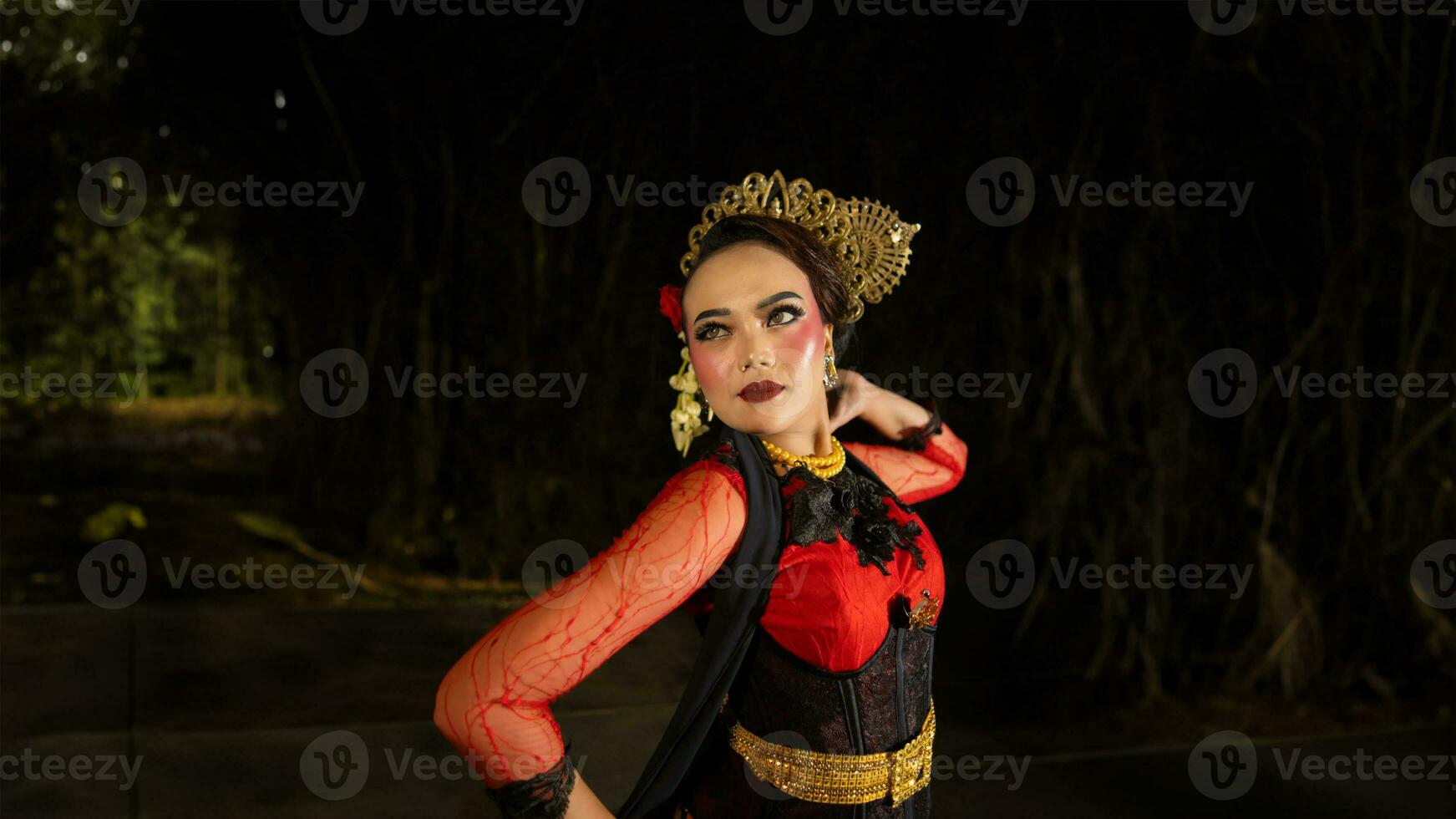 an Indonesian dancer shows a dance that shows the beauty of a tradition full of stories in every movement photo