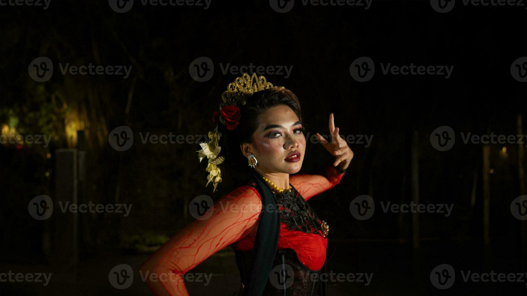 an Indonesian dancer with sparkling stage lights that create the impression of luxury and elegance photo
