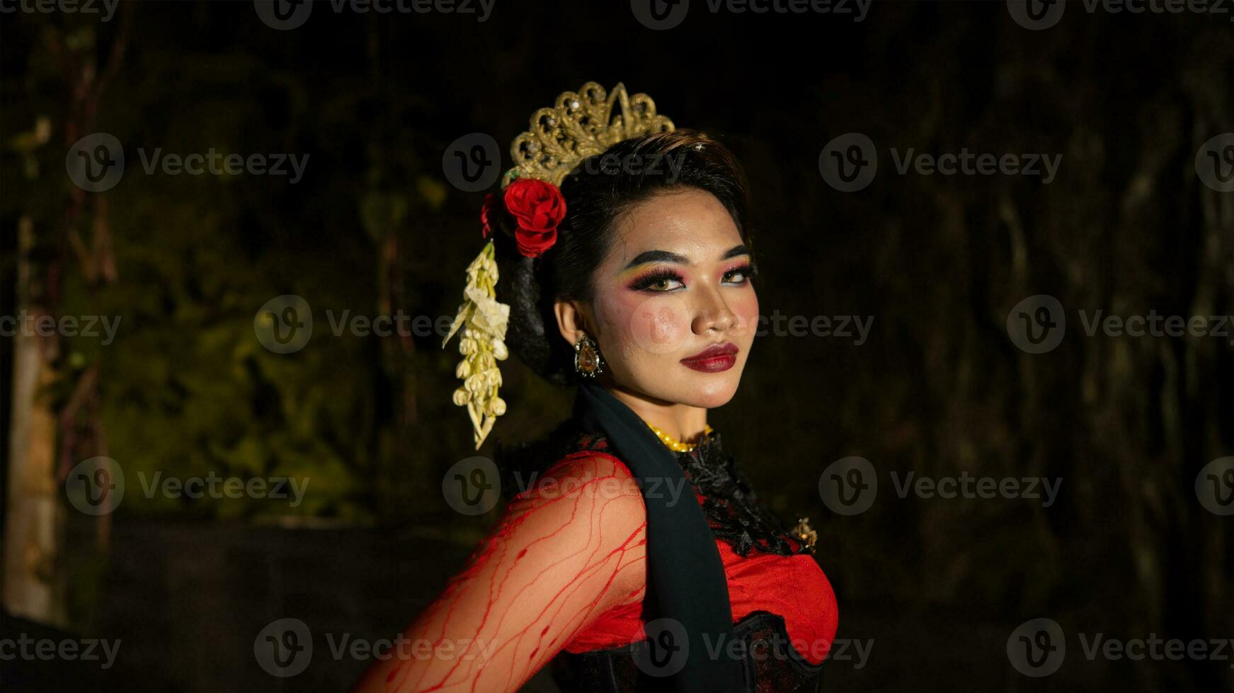 an Indonesian dancer with sparkling stage lights that create the impression of luxury and elegance photo