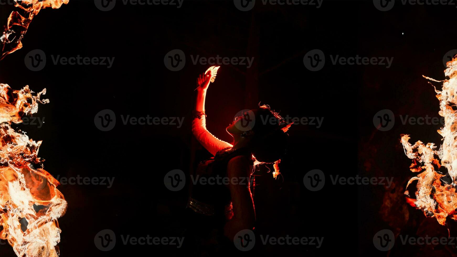 a woman holding gold jewelry with trembling hands and full of worries photo