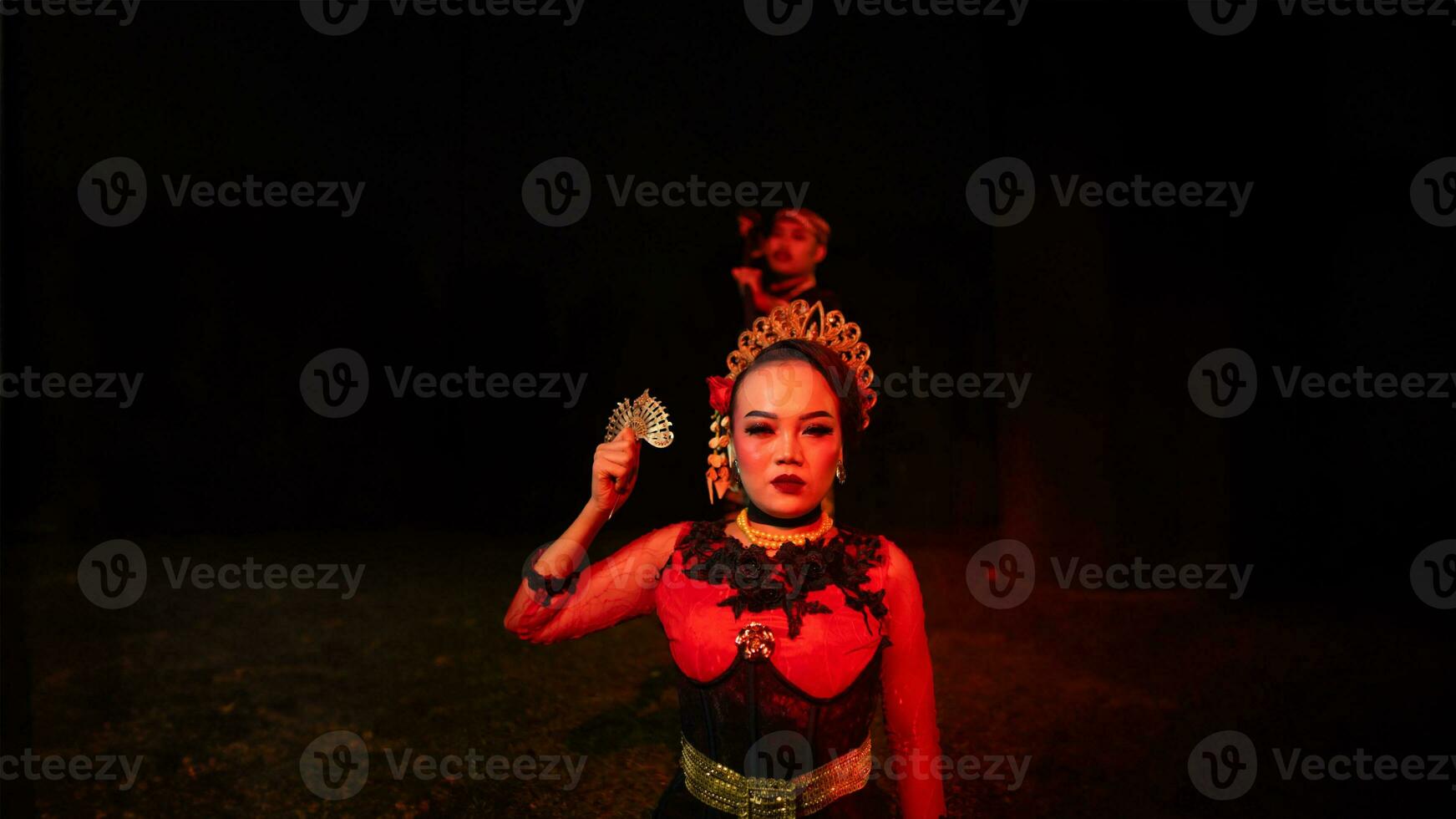 a group of female dancers with faces full of heavy emotional burdens sitting in the dark of night photo