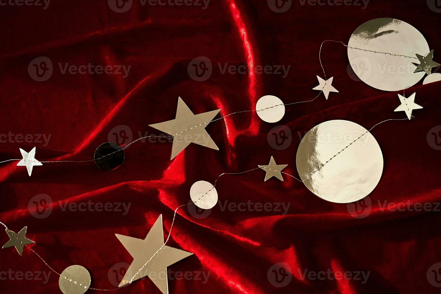 Abstract Christmas background made of red velvet fabric with stars. photo