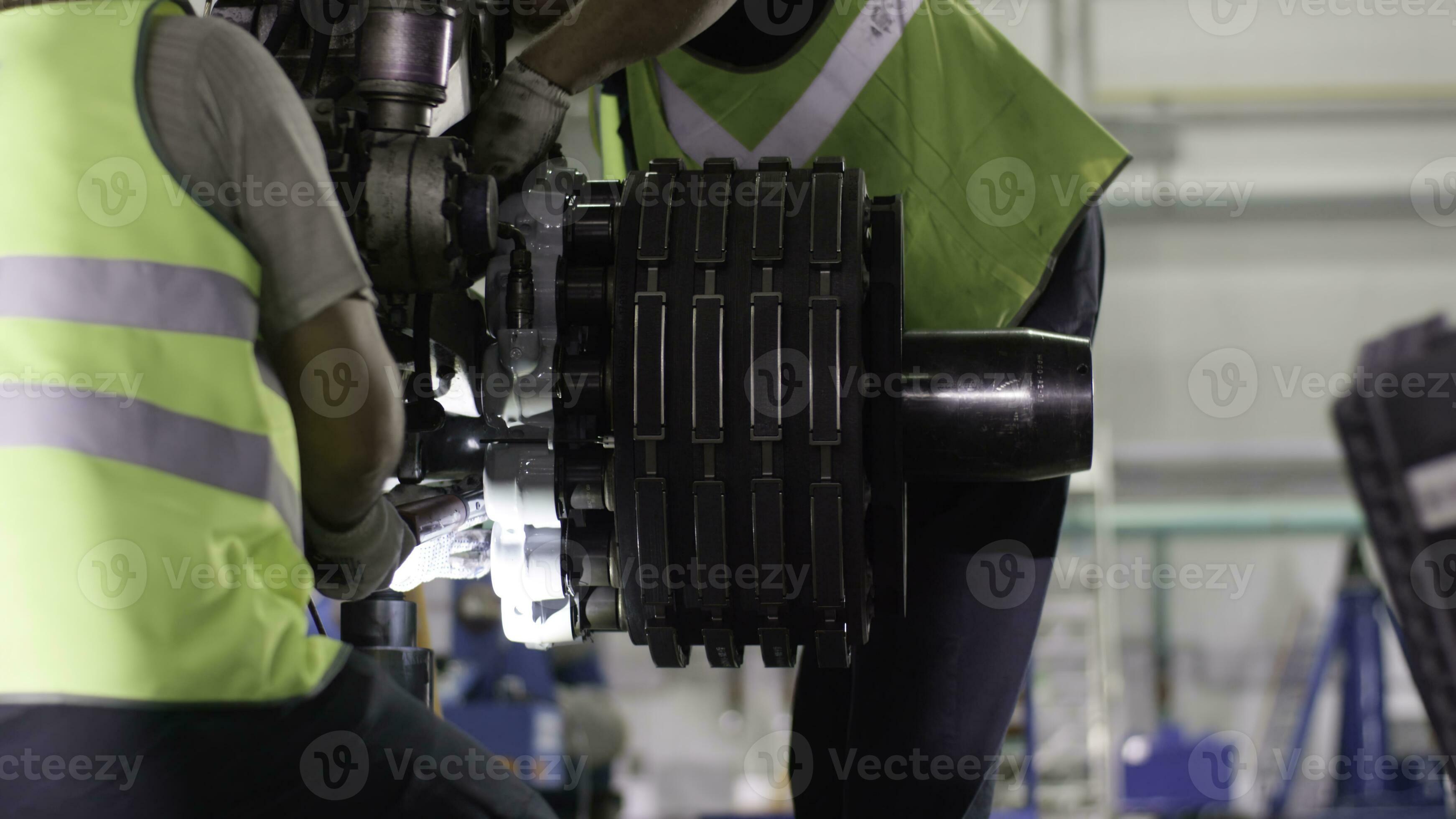 Calm workers controlling aircraft machine and chassis. Aircraft