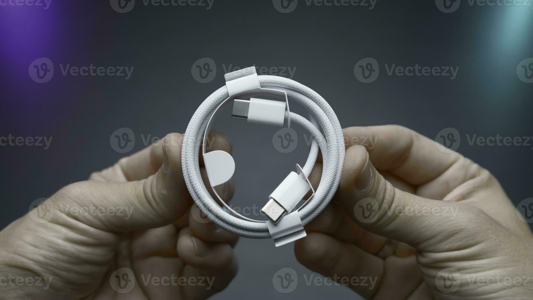 Close-up of type C wire for charging phone. Action. Type-C connector for charging phone on isolated ofn. New wire type C and included for phone photo