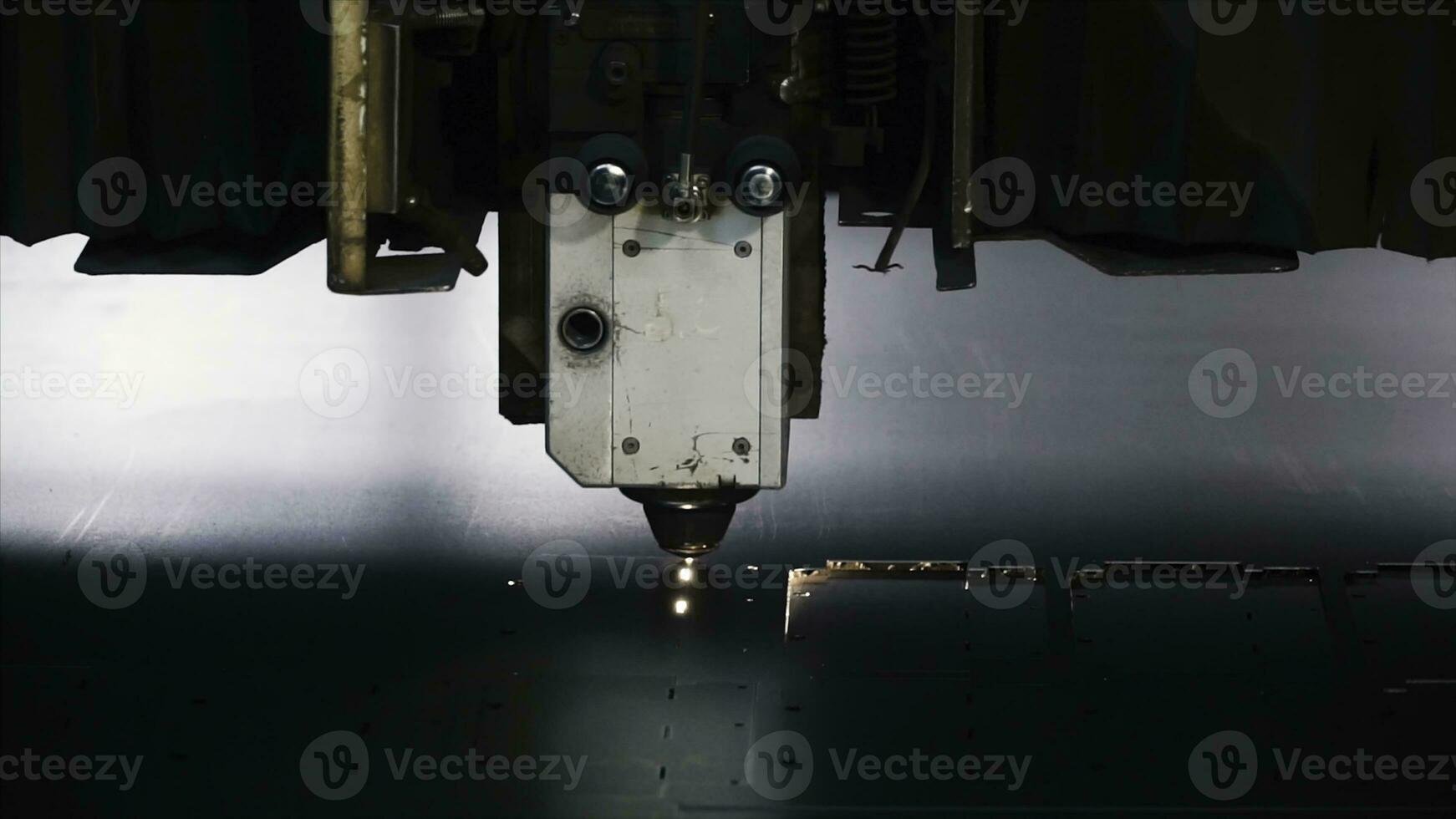 Laser machine cutting of sheet metal. Clip. Sparks fly from laser by automatic cutting CNC, PLC machine photo