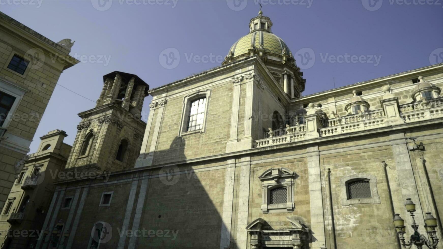 Famous old Cathedral in European historical city on background of sky. Action. Cathedral of white stone with dome in center of ancient European city photo