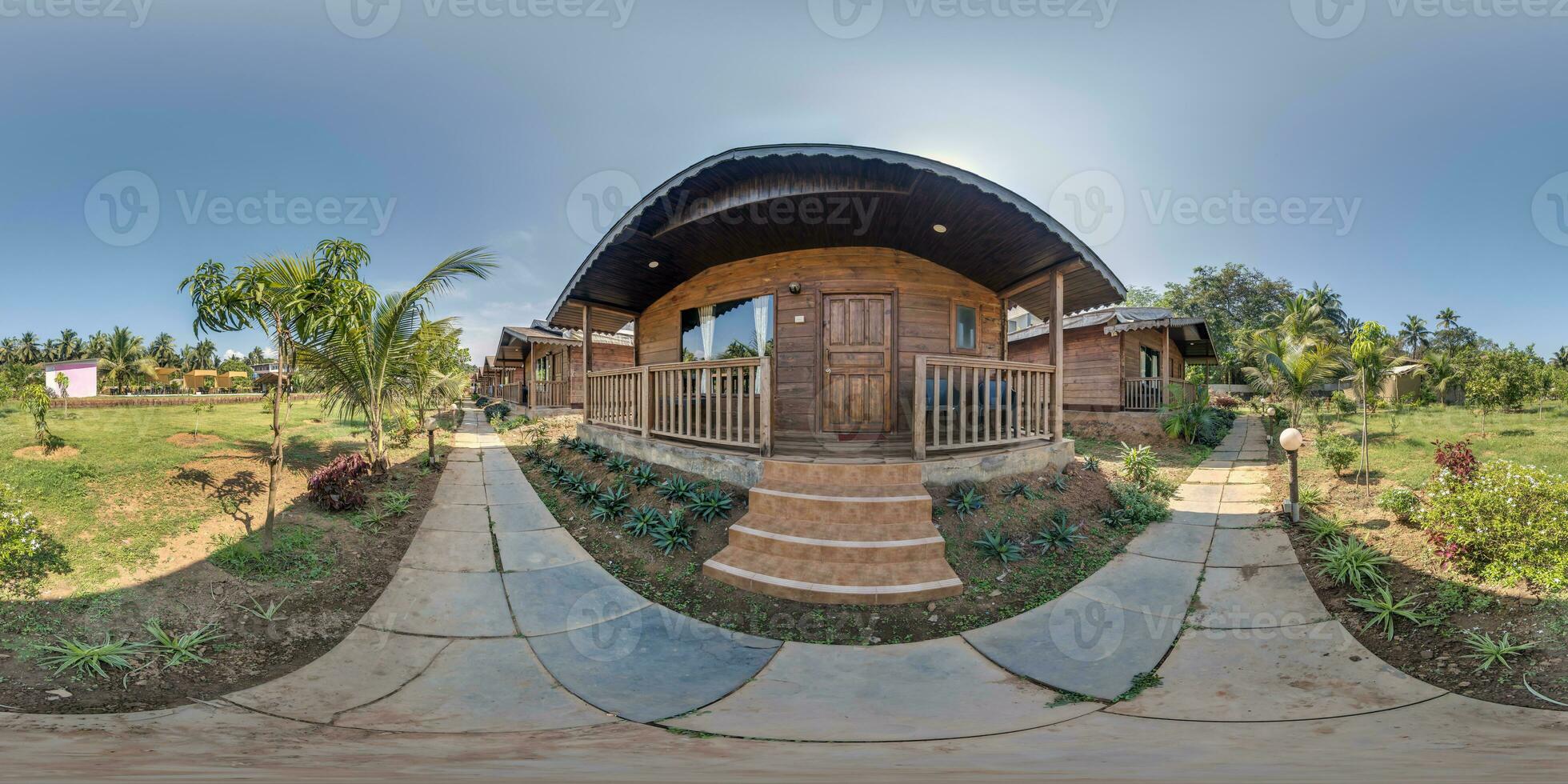 360 hdri panorama with coconut trees near wooden tourist eco houses in equirectangular spherical seamless projection photo