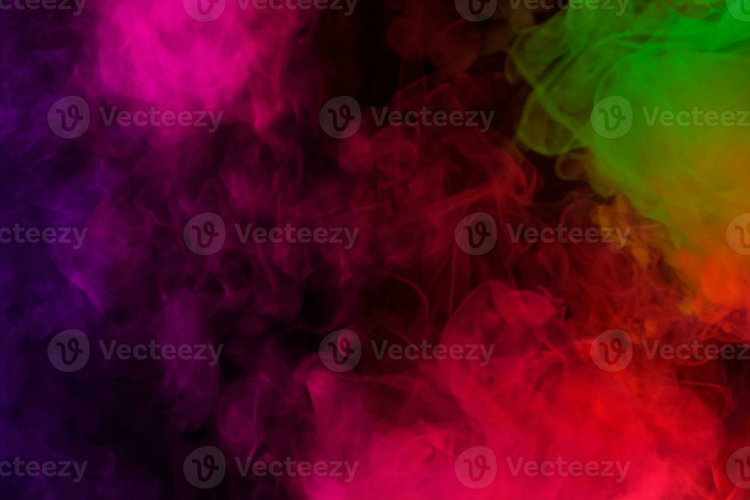 Colored smoke clouds flowing dark abstract background photo