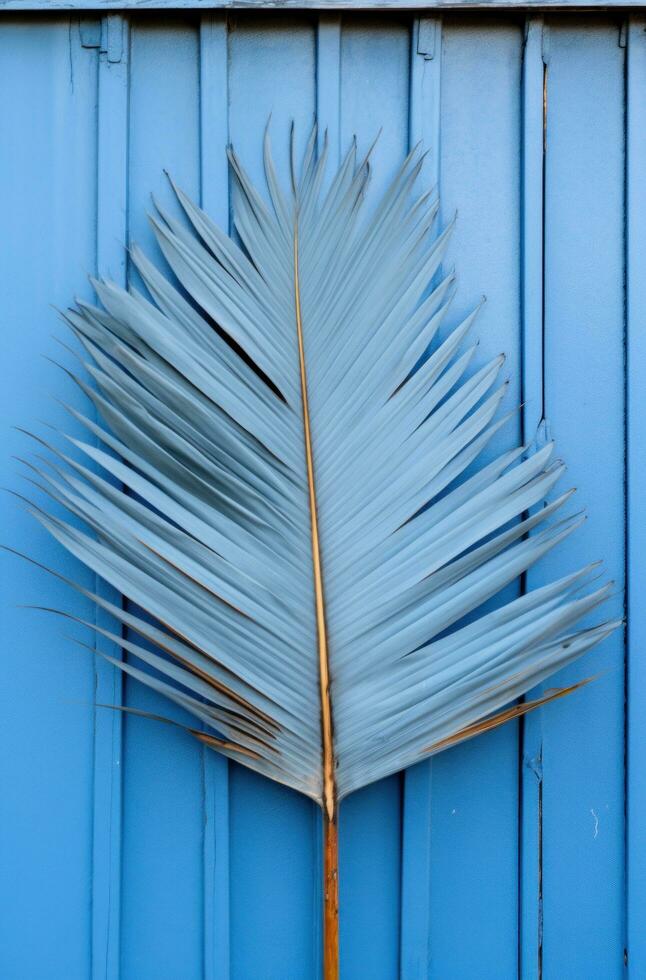 AI generated a palm leaf is on a wall close to a fenced in yard with a blue gate photo