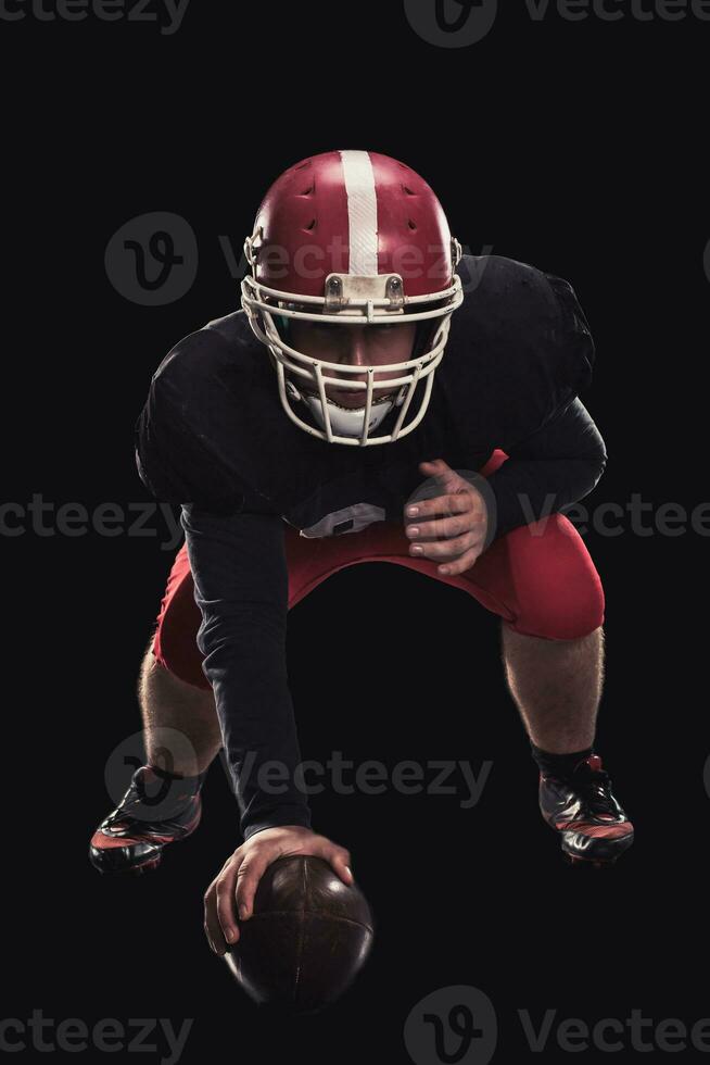 Football player on dark background photo