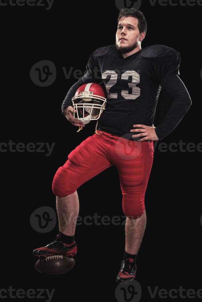 Football player on dark background photo