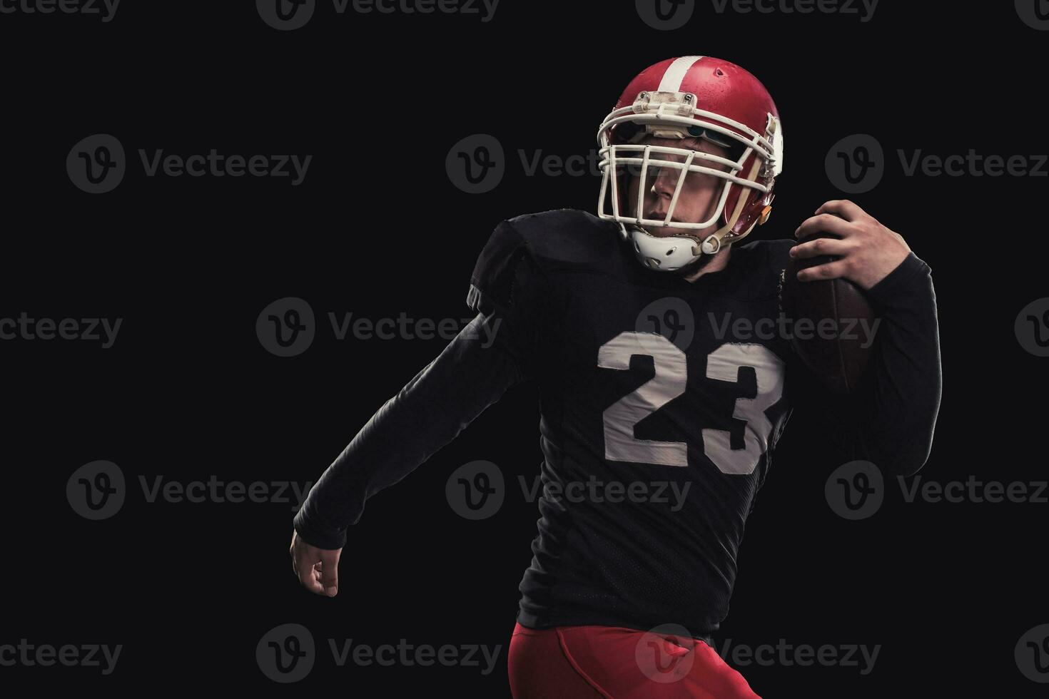 Football player on dark background photo