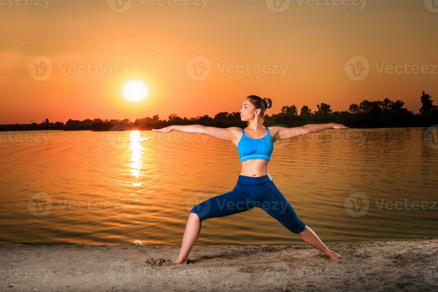 yoga at sunset on the beach. photo