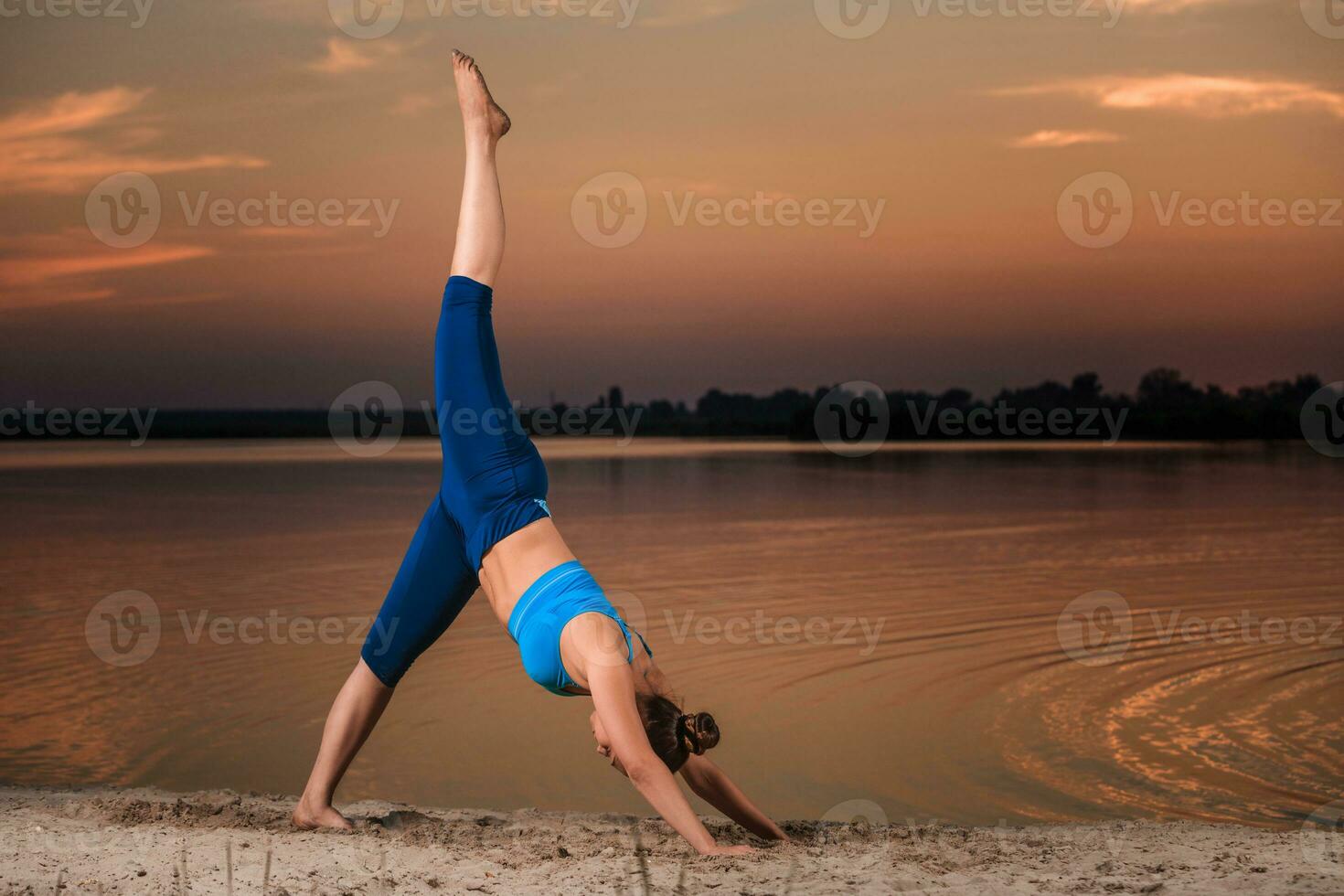 yoga at sunset on the beach. photo