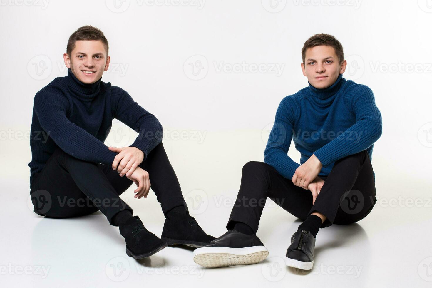 Casual twin brothers. Studio shoton a white background photo