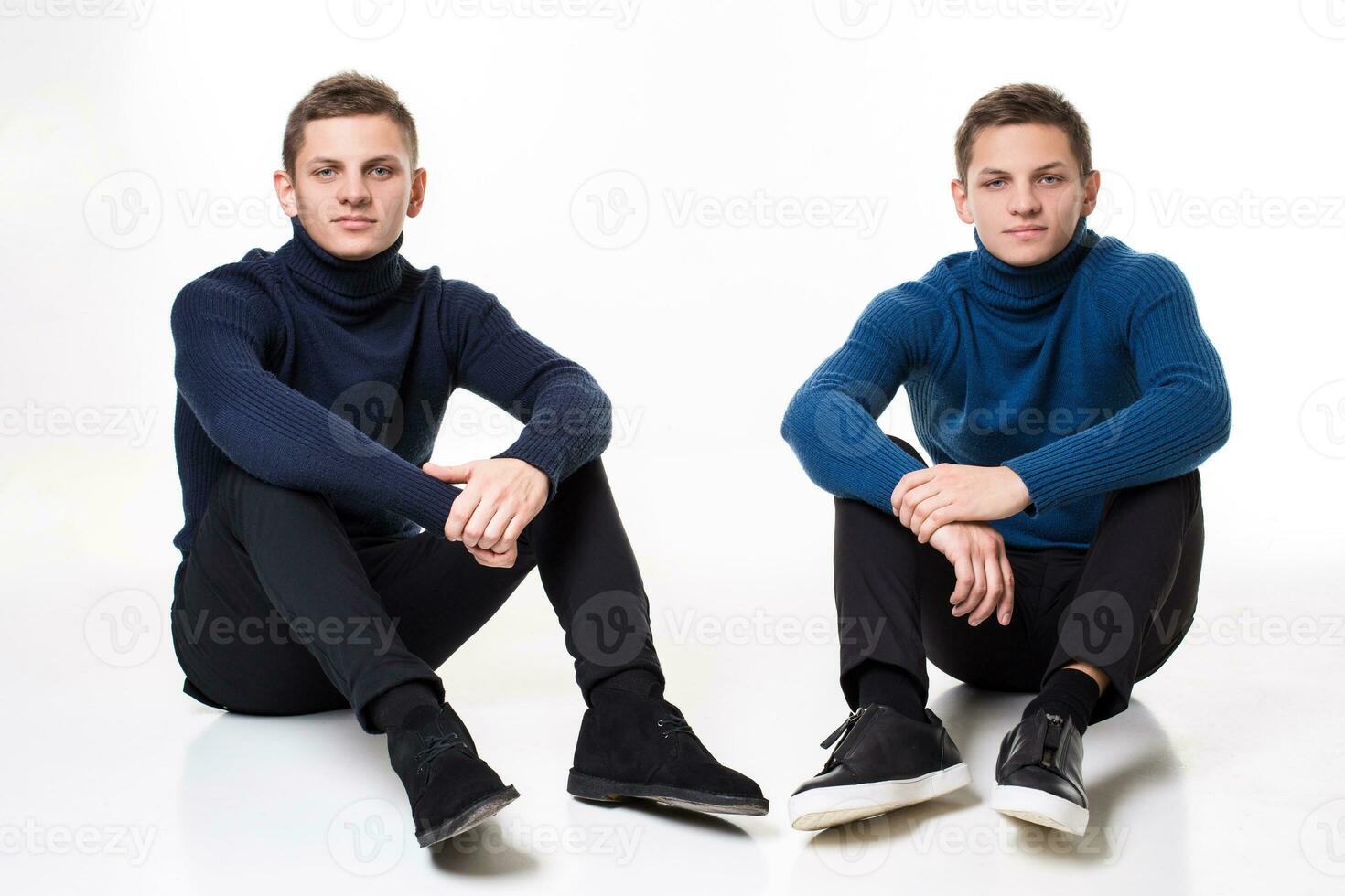 Casual twin brothers. Studio shoton a white background photo