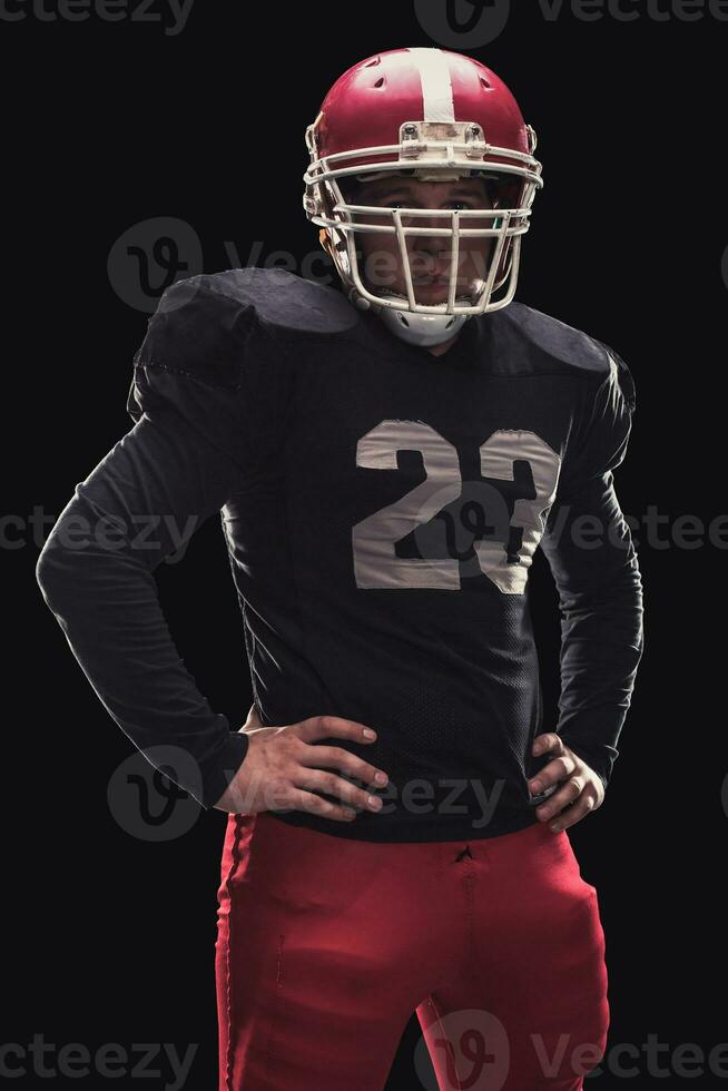 Football player on dark background photo