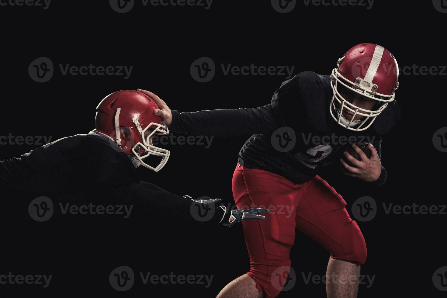 Football player on dark background photo