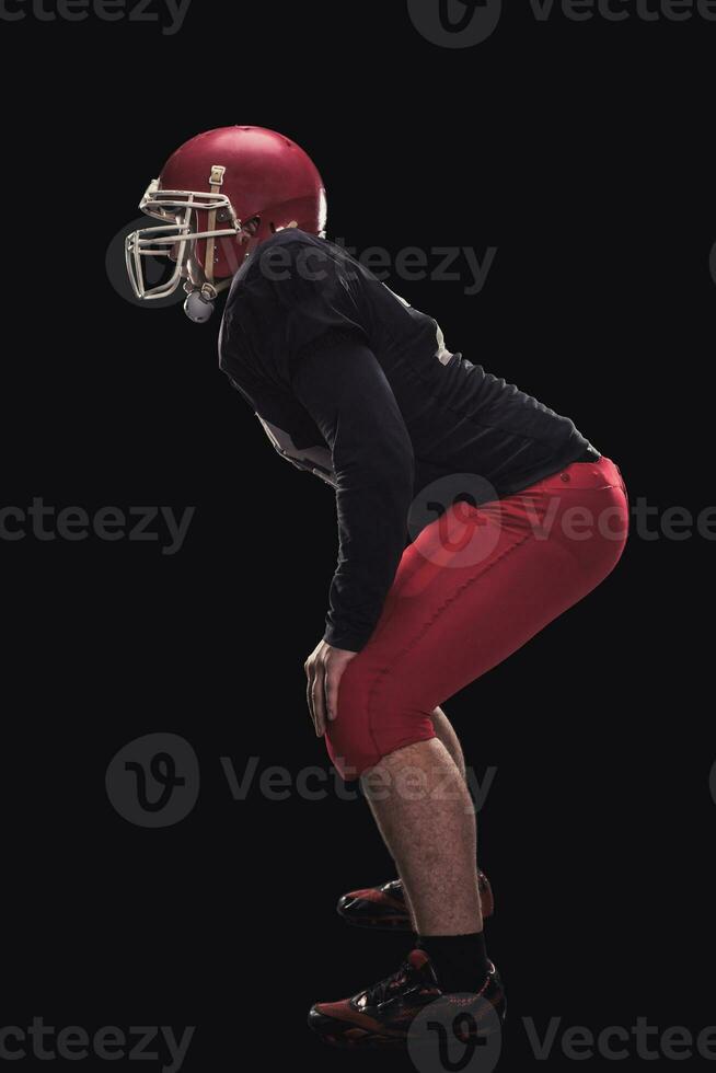 Football player on dark background photo