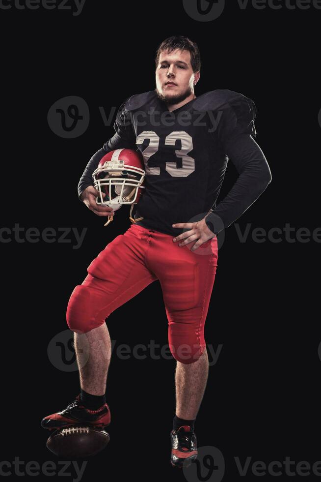 Football player on dark background photo