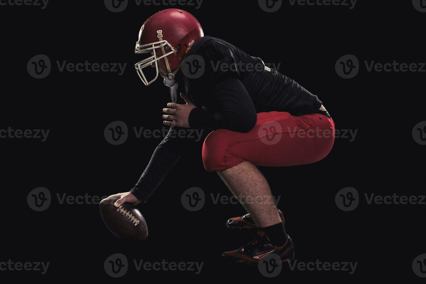 Football player on dark background photo