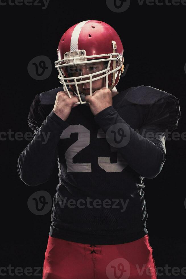 Football player on dark background photo