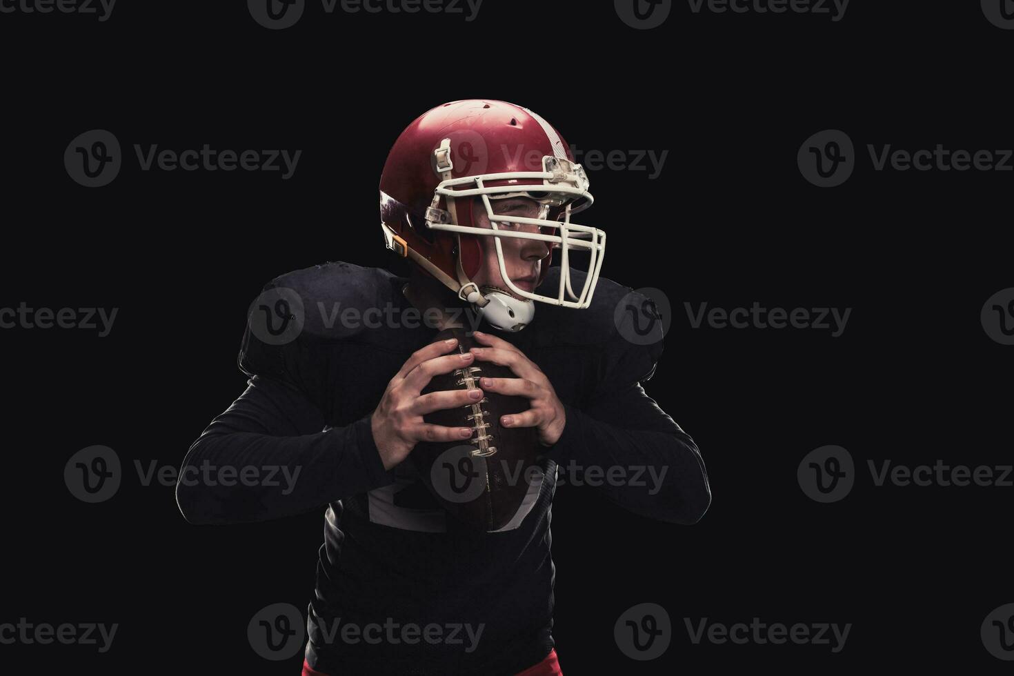 Football player on dark background photo