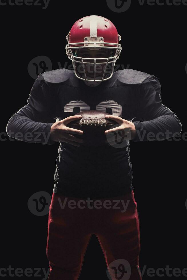Football player on dark background photo