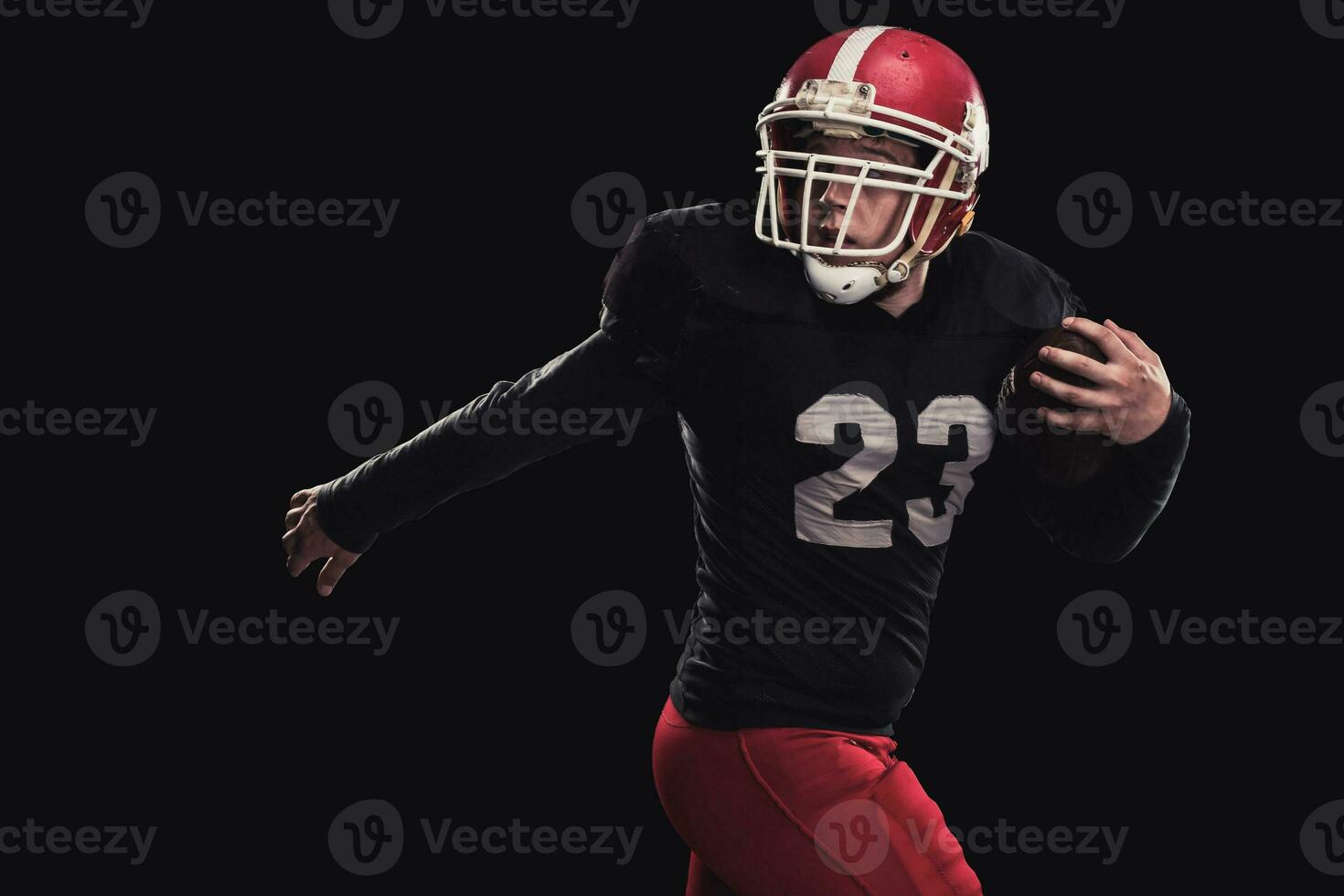 Football player on dark background photo