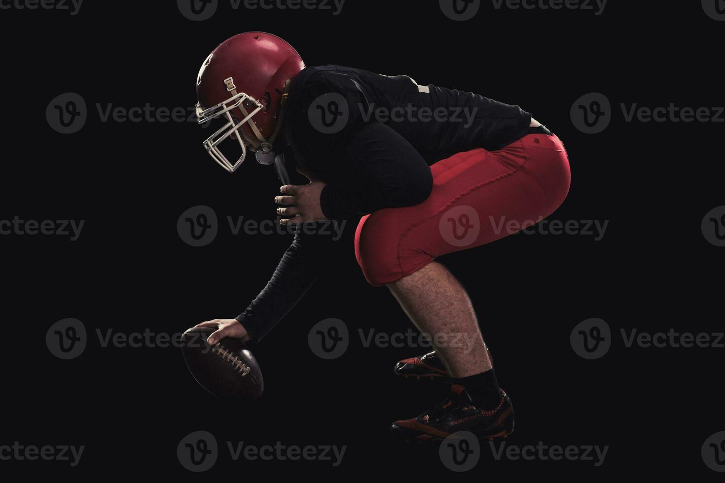 Football player on dark background photo