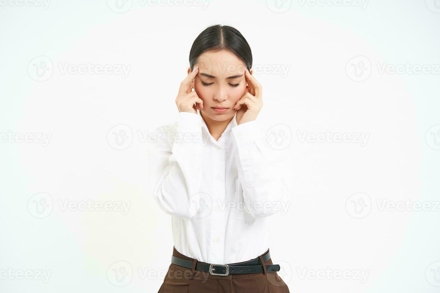 Tired corporate woman, office manager holds hands on head, has headache or migraine, stressed at work, whtie background photo