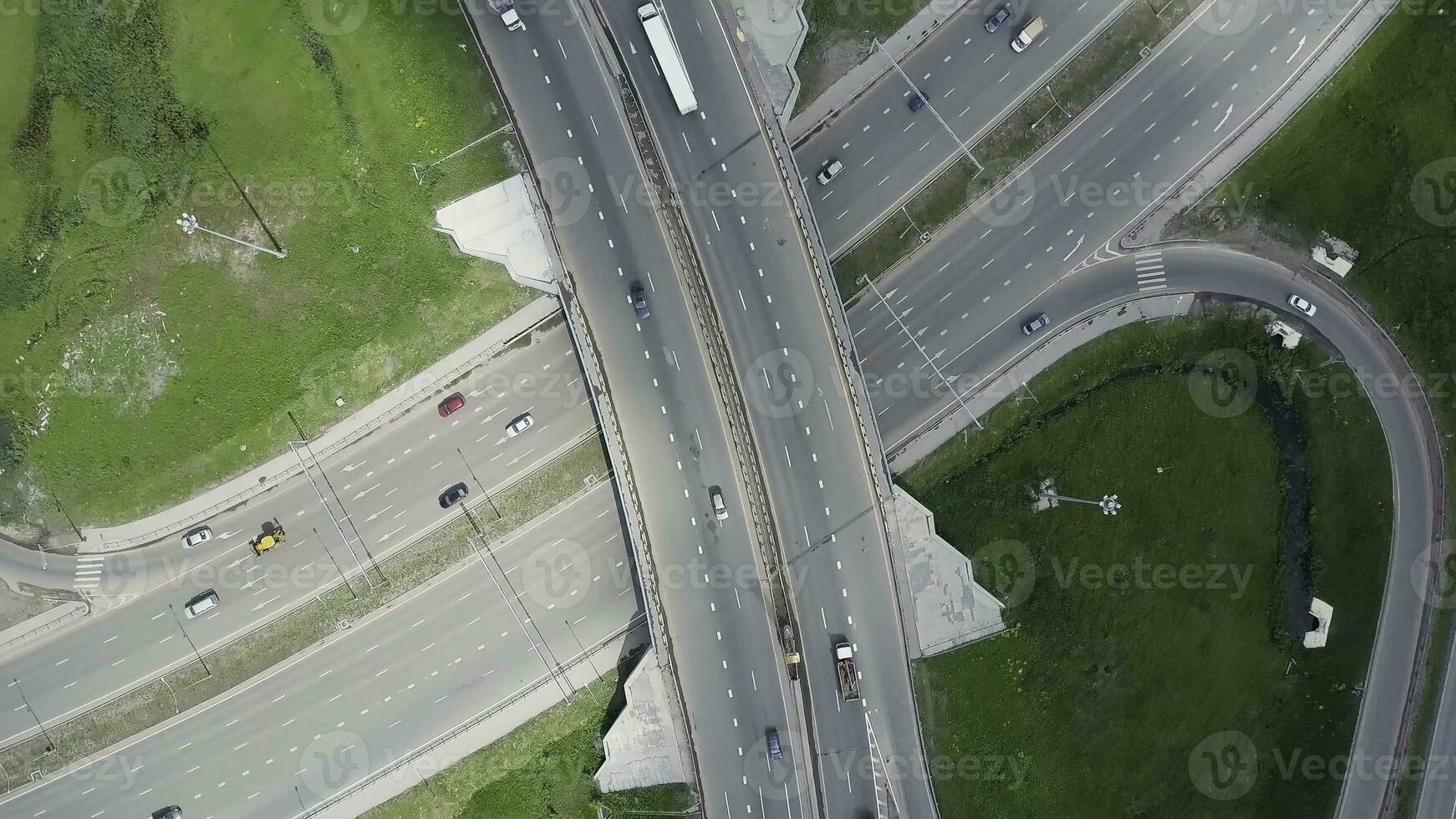 Elevated expressway. Clip. Top view at curves and lines of city highway. The curve of suspension bridge. Background scenic road photo