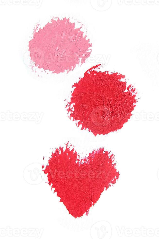 Red and pink lipstick swatch isolated on white background, cosmetic product, brush stroke, swipe sample. photo