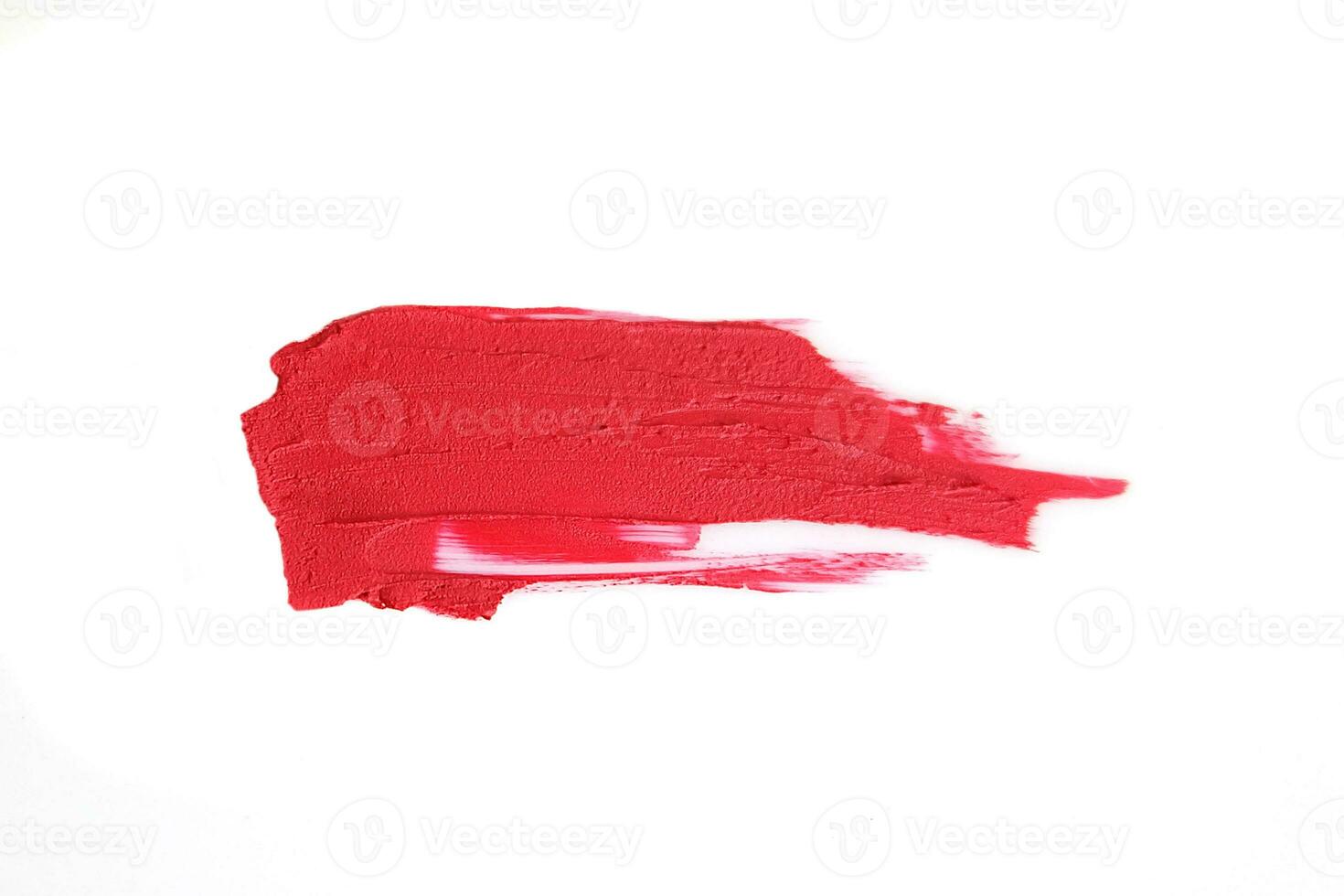 Red lipstick swatch isolated on white background, cosmetic product, brush stroke, swipe sample. photo