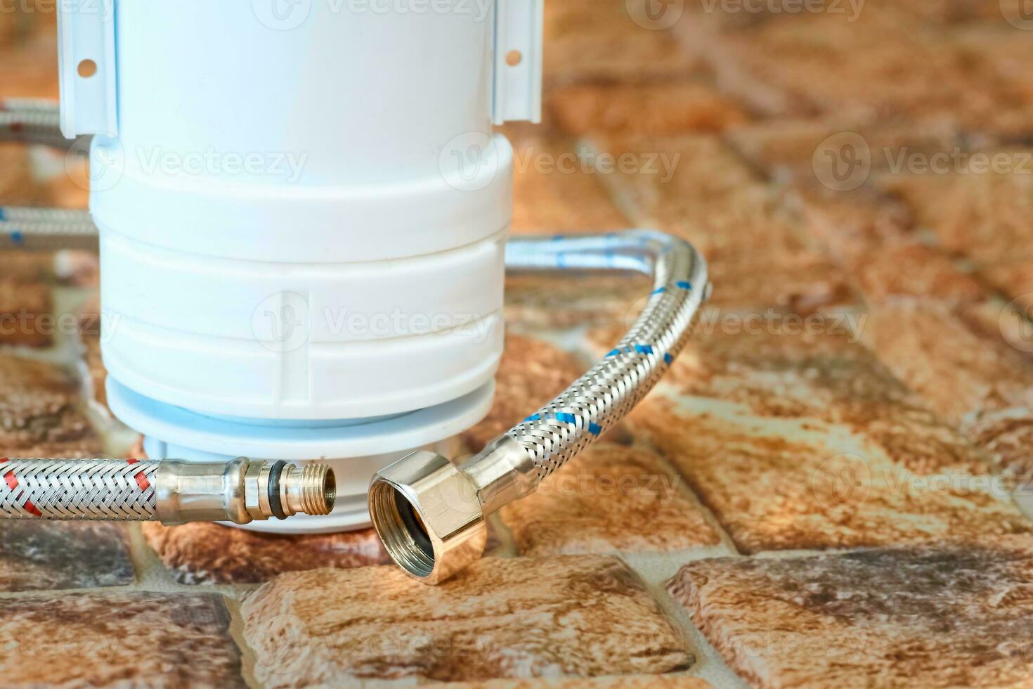 Plumbing. Flexible metal steel faucet hoses, flush mechanism, siphon fittings photo