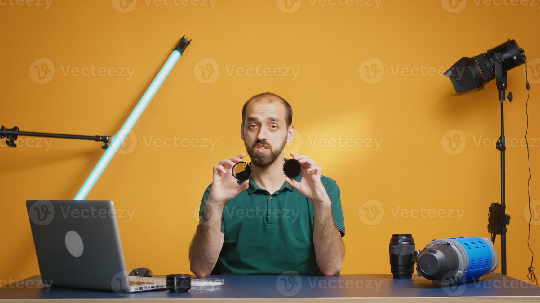 Photography blogger recording nd filter comparison for camera lenses. Variable ND filter review, camera gear and equipment video. Ceator influencer social media star distributing online content photo