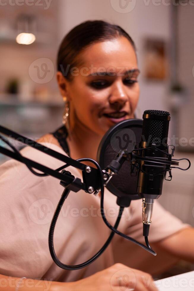 Close up of social media star talking in the microphone. Creative online show presenter, On-air online production internet broadcast show host streaming live content, recording digital social media photo