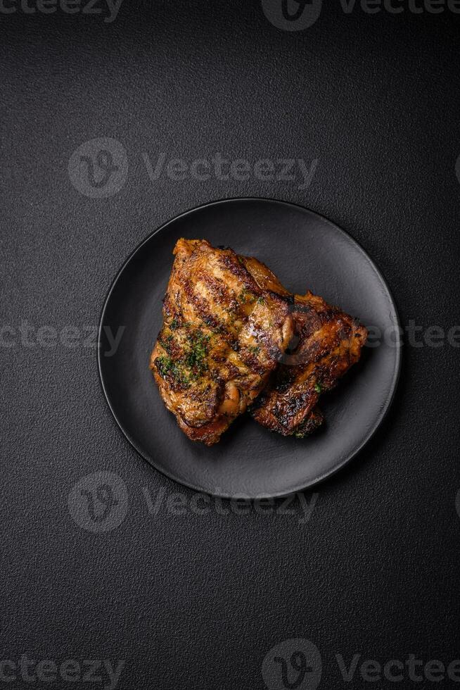 Delicious juicy beef or chicken steak with salt, spices and herbs photo