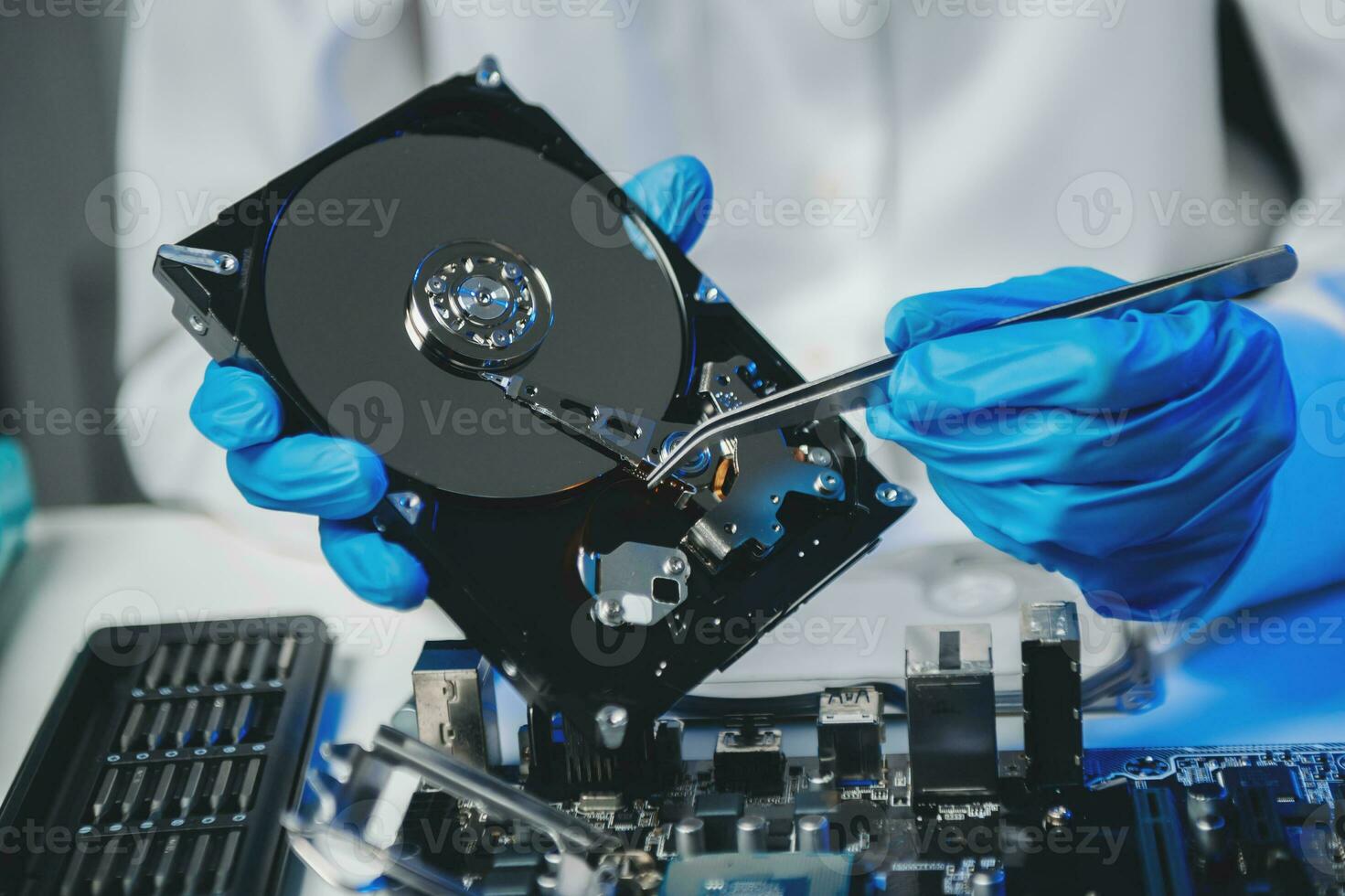 The technician is putting the CPU on the socket of the computer motherboard. electronic engineering electronic repair, electronics photo